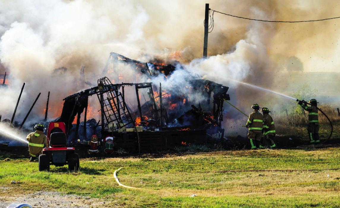 La Grange Volunteer Fire Department battled a house fire in Hostyn Thursday afternoon, Dec. 14. Photo by Andy Behlen