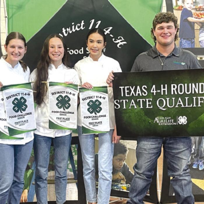 3 Girls in Chef Coats: Tori Newton, Eleanor Carey, Elena Supak, District 11 4-H Council Officer.
