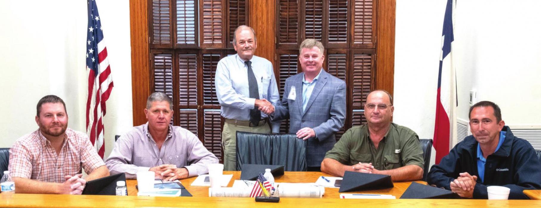 Fayette County Commissioners contributed $500,000 of federal grant funds from the American Rescue Plan to St. Mark’s Medical Center’s capital improvement campaign. Pictured are (standing) County Judge Joe Weber and St. Mark’s CEO Mark Kimball, (seated) Pct. 4 Commissioner Drew Brossmann, Pct. 3 Commissioner Harvey Berckenhoff, Pct. 2 Commissioner Luke Sternadel and Pct. 1 Commissioner Jason McBroom. Photo by Andy Behlen