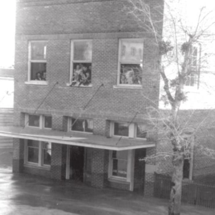 1913 floodwaters rose past this building that is now the eastern half of Hengst Printing and Office Supplies at 155 W. Travis Street in La Grange. Dark areas along the lower walls show that floodwaters had already receded about eighteen inches by the time this photo was taken. Photo courtesy of the Fayette Heritage Museum and Archives