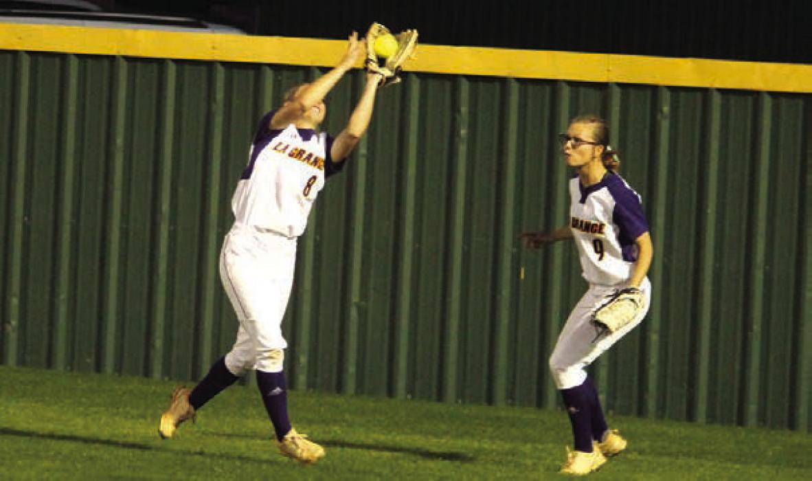 La Grange’s Haylie Cooper catches a ball in the outfield Monday as her sister Haedyn backs up in the play.