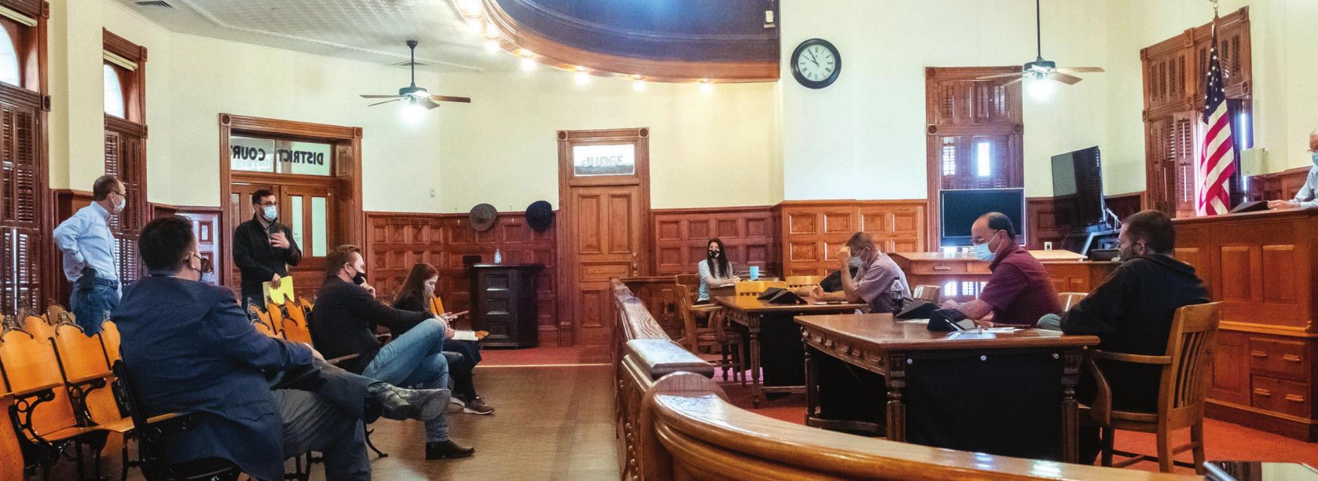 District Judge Jeff Steinhauser (far left) asked Fayette County Commissioners last week to designate a few alternate locations for district court proceedings. Steinhauser said the historic district courtroom, pictured above, cannot accommodate jury trials under social distancing rules issued by the State. Photo by Andy Behlen