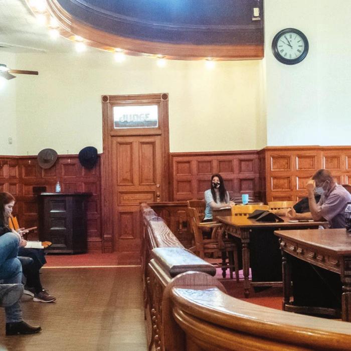 District Judge Jeff Steinhauser (far left) asked Fayette County Commissioners last week to designate a few alternate locations for district court proceedings. Steinhauser said the historic district courtroom, pictured above, cannot accommodate jury trials under social distancing rules issued by the State. Photo by Andy Behlen