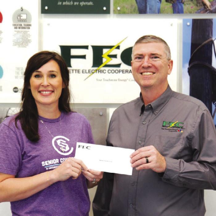 Funds donated by Fayette Electric Cooperative members were donated to Senior Connections. Pictured from left to right are: Senior Connections Executive Director Amanda Kridel and Fayette Electric Cooperative General Manager Doug Lambert.