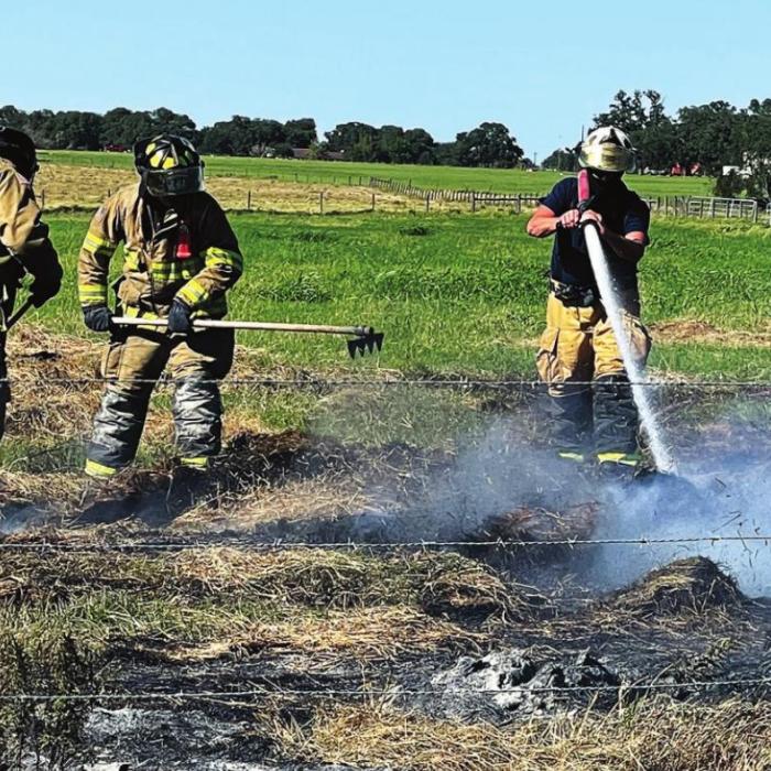 Firefighters battled strong winds last week in a fire near Fayetteville that took three days to put out. Photo by Andy Behlen