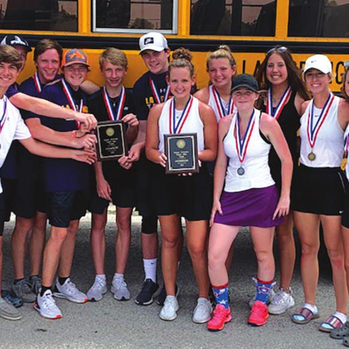 The La Grange varsity tennis players hold up their district title plaques.