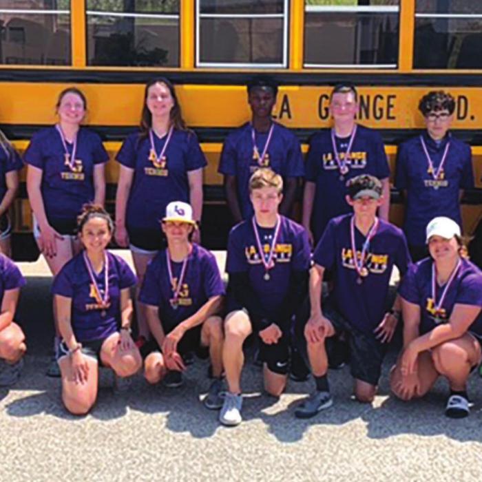 The members of the La Grange JV tennis team show off their district medals.