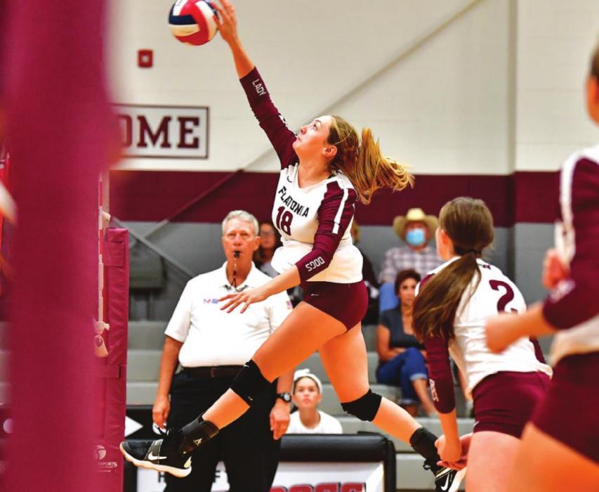 Karli Siptak goes up for a hard hit for Flatonia in Friday’s match against Bellville. Photo by Stephanie Steinhauser
