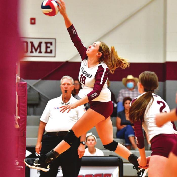 Karli Siptak goes up for a hard hit for Flatonia in Friday’s match against Bellville. Photo by Stephanie Steinhauser