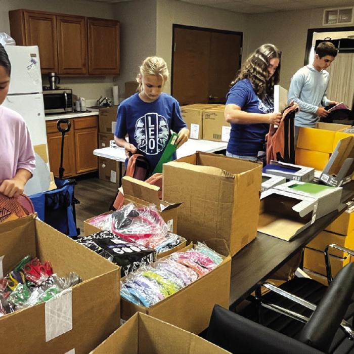 This Saturday, Tejas Healthcare will again host its free annual Back to School Festival. Wednesday volunteers, many of them students (some shown above), packed 600 backpacks full of school supplies that will be given away at the event. The supplies were made possible thanks to donations from area businesses, churches and service organizations. Saturday’s festival will be Saturday, Aug. 1 from 10 a.m. to Noon at the Tejas Healthcare Community Garden at 753 E. Travis Street in La Grange. Photo by Jeff Wick
