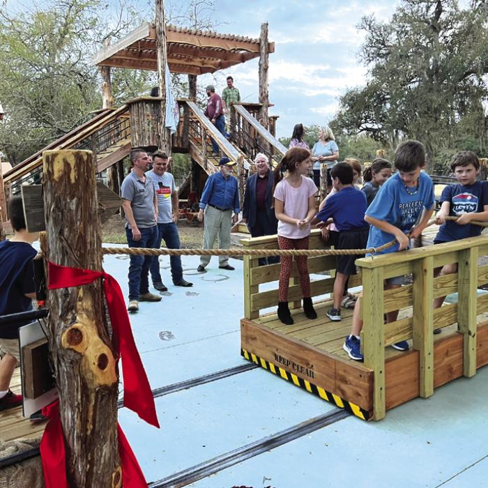 Children use the Kreische ferry to cross the “Colorado River” on the educational playscape.