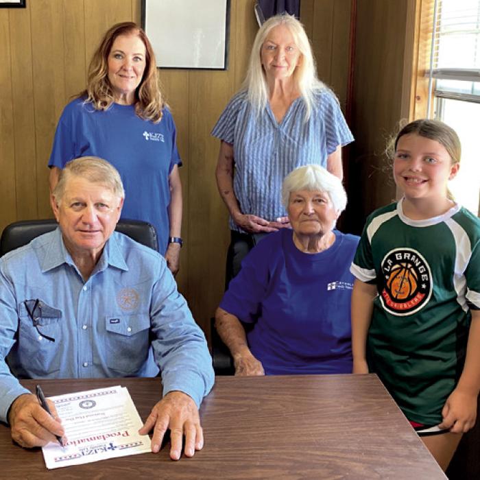 Ellinger Mayor Matt Mikulenka signed a proclamation presented by KJZT Family Life Society 41 of Ellinger designating June 14 as National Flag Day in Ellinger.