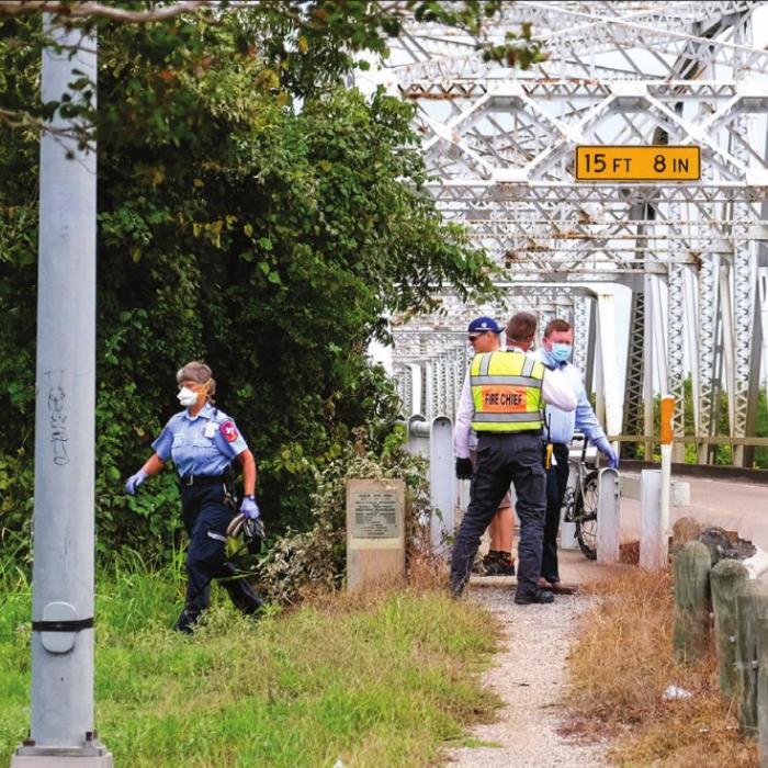 Woman Tumbles Down River Bridge Embankment