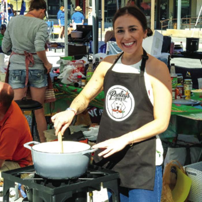 Bre Cooper with the Presley’s Pot team out of Houston gives her chili a stir on Saturday. Photos by Andy Behlen