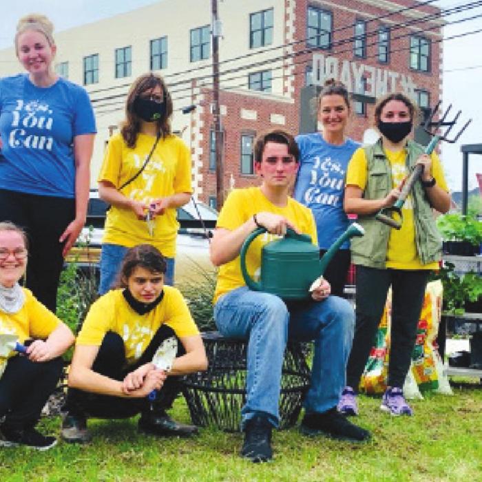 Pictured standing from left is: Amber Treybig, Joelle Mihalovich-Williams, Erin Wotipka, and Mary Wellborn; kneeling/sitting is: Shayleigh Staal, Jessica Shank, and Grant Woodward.