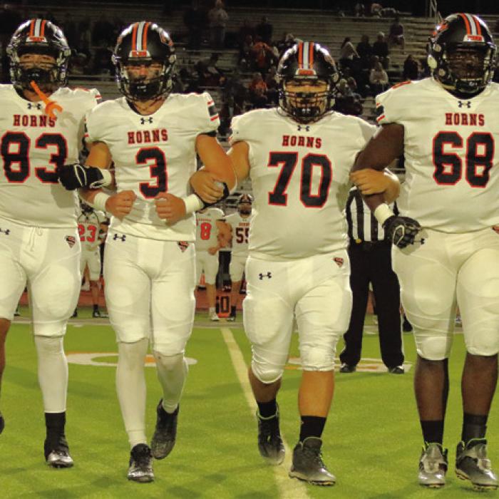 The Schulenburg captains walk to the coin toss before Friday’s game, left to right: Jayvan Luhrs, Aaron Janecek, Marshall Wellborn and Rogerick Walton. Photo by Darrell D. Gest