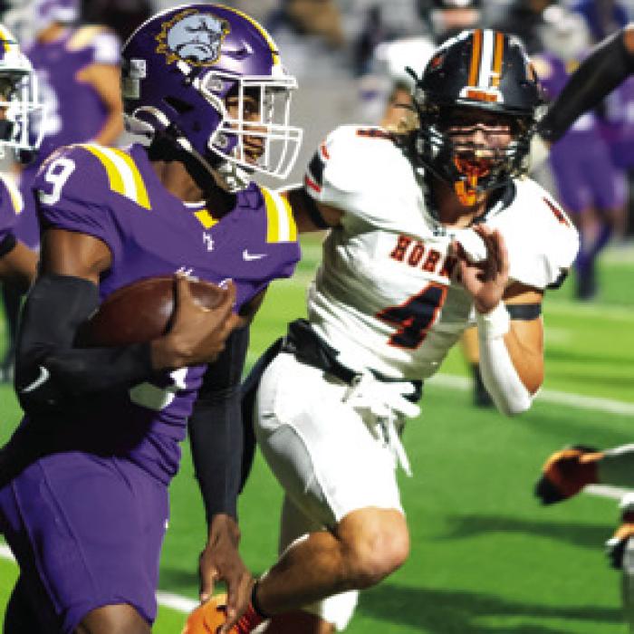 Jayse Janda pursues Marlin quarterback Roderick Suiters. Photo by Andy Behlen