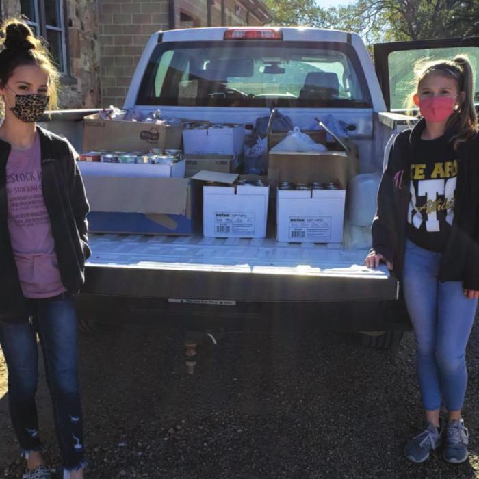 The Round Top-Carmine Jr. Beta Club collected 862 lbs. of food for the AMEN food pantry located in La Grange. Pictured with the boxes of food are Bayley Pitts, Vice President of the club (left), and Tess Eilers, President (right). Students at the RT-C High School and Jr. High campus in Carmine participated in the event.