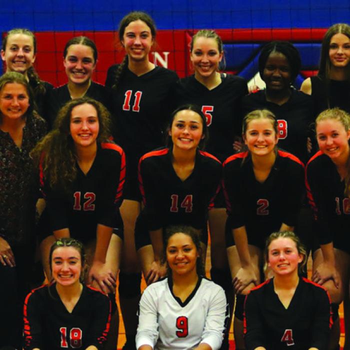 The Lady Horns volleyball team poses after Tuesday’s victory.