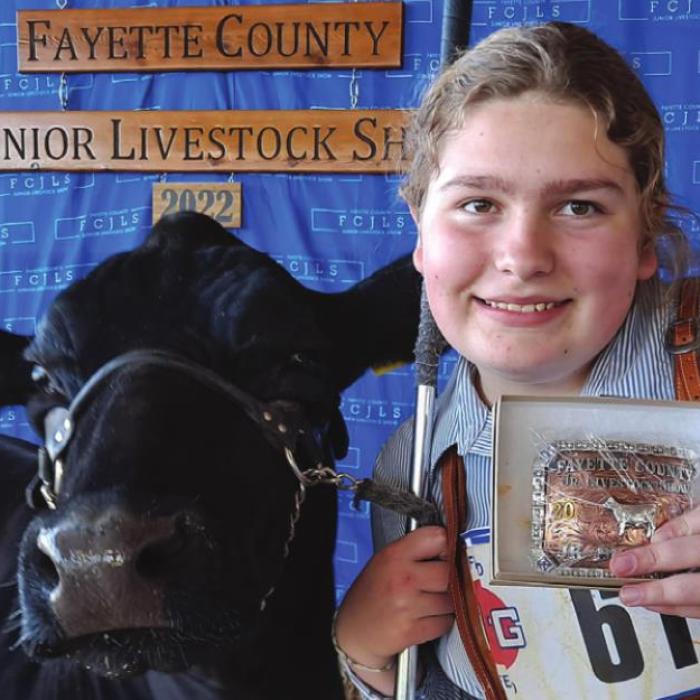 Rhegan Karisch and her steer, Ash, placed fourth in the light weight division and won Champion Junior Steer Showmanship at the Fayette County Junior Livestock Show.