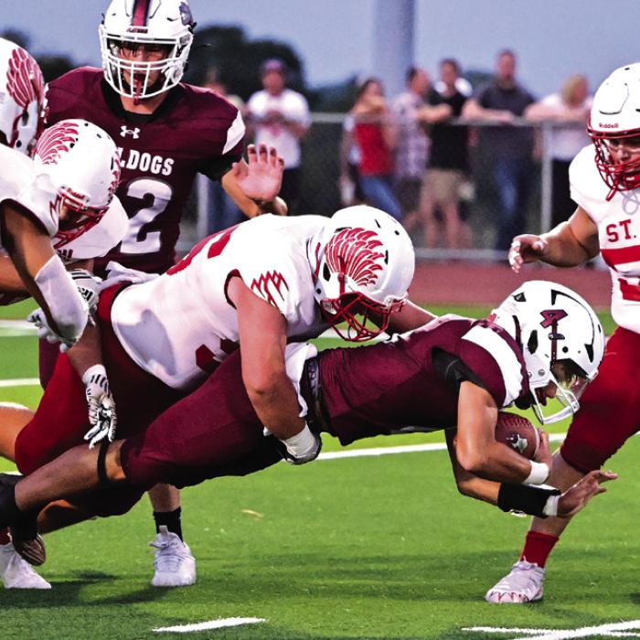 Junior Quarterback Beck Zimmerman dives to get the first down for The Flatonia Bulldogs in Friday nights 49-26 win over Shiner St. Paul. Photo by Stephanie Steinhauser