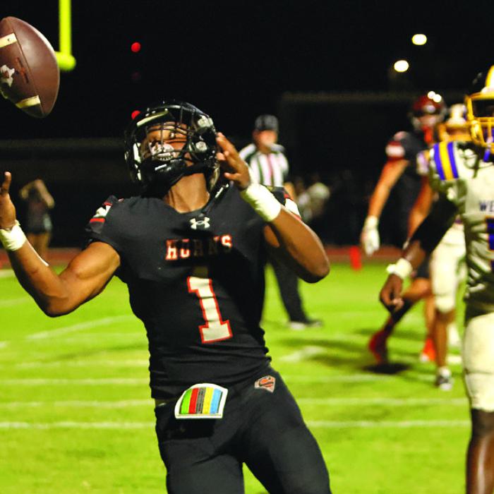 Schulenburg’s Daterrion Houston bobbles the ball in the endzone Friday before coming down with the touchdown catch. Photo by Darrell D. Gest