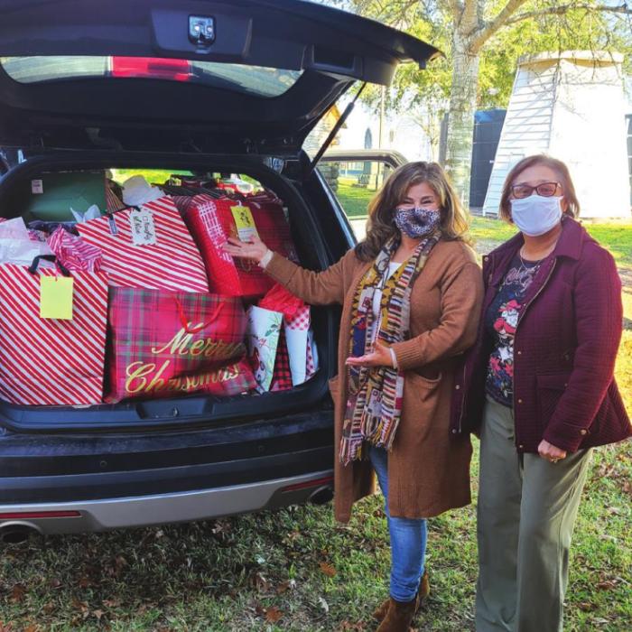 Noelia Buck, left, Senior Nutrition Program Director and Mary Lou Anderle, right, Histyn Parish Office Assistant pose with some of the Angel Tree donations.