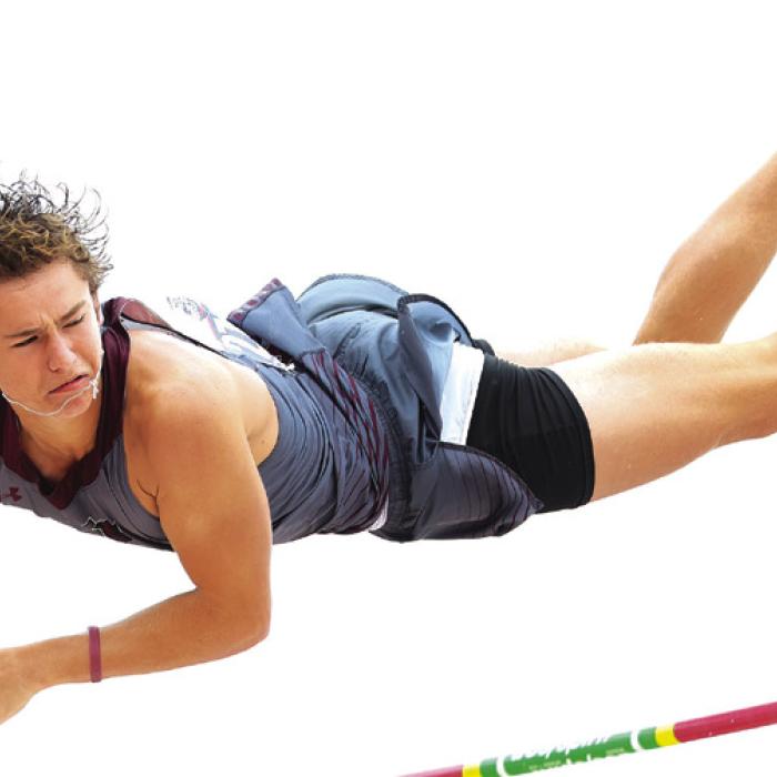 Fayetteville’s Lawson Fritsch soars to a win in the 1A pole vault.
