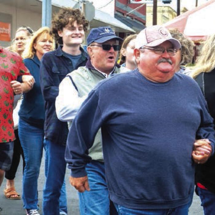 Gary and Ann McBride led the grand march on North Main St. Photos by Andy Behlen