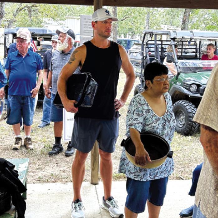 The lines for BBQ at Holy Cross church picnic are a reflection of how popular their BBQ is in the Warda community.