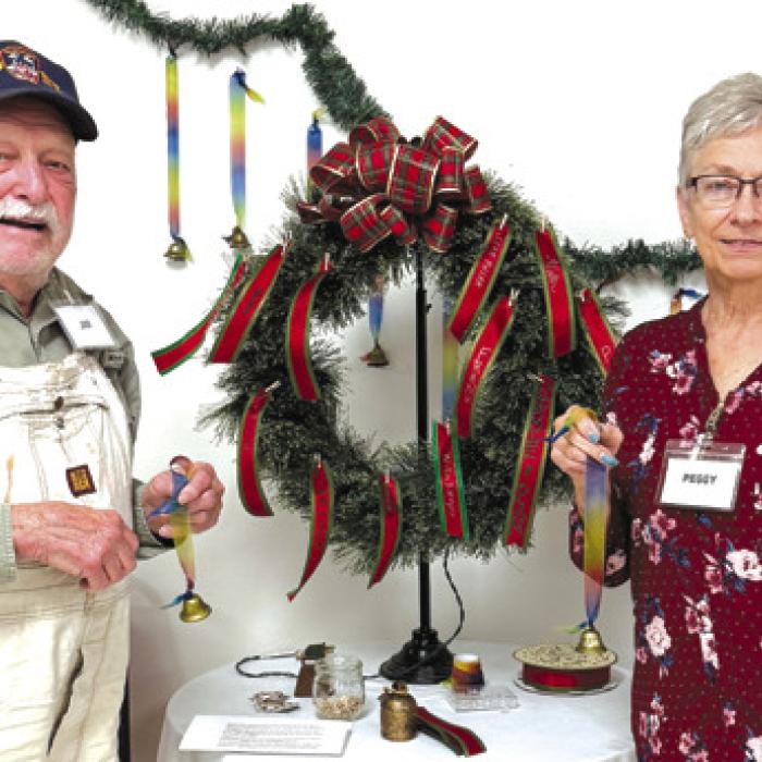 Recently at Senior Connections we had a discussion about holiday traditions and how those traditions change when we lose a loved one. We talked about how we can honor them and keep them present during the holidays. We ended this discussion signing our loved ones names to a bell and ringing it in unison remembering that whenever a bell rings an angel gets its wings. Pictured here is Jim Walker and Peggy Hiatt.