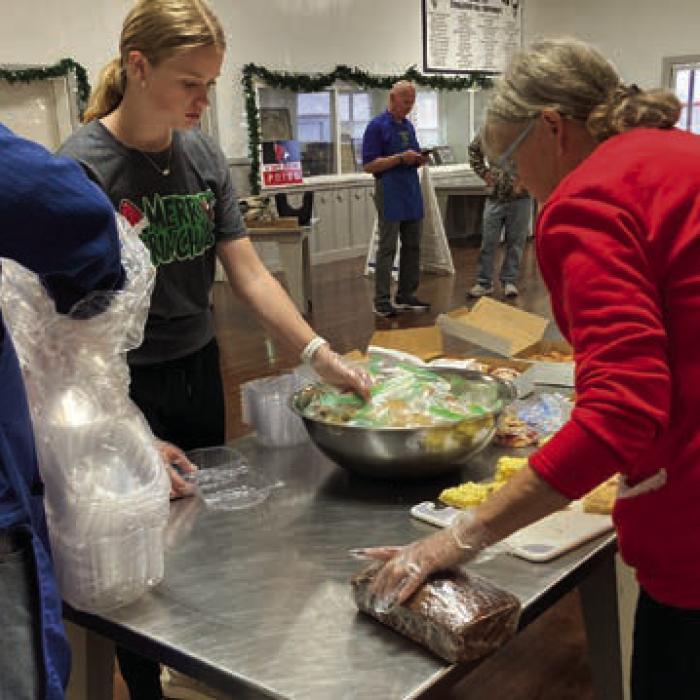 Volunteers gathered at the Schulenburg KC Hall on Dec. 25 to serve a turkey dinner to community members who didn’t have anyone else to celebrate with on Christmas. More than 90 plates were served. The annual event has been drive-through only ever since the COVID pandemic. But next year, volunteers hope to offer a dine-in meal so the community members gather for Christmas Day. Photos by Debbie Behlen