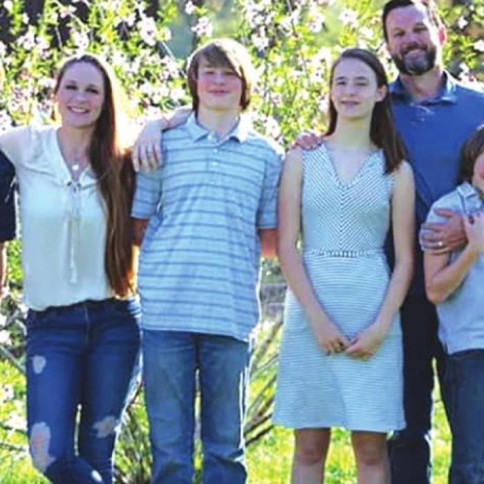 Kim Landis, her husband Marc, and their four kids.