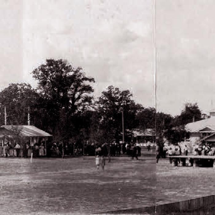 Ladies with Spinning Wheels at Fairgrounds – 1929: Photograph of four elderly women with spinning wheels in front of the exhibit hall at the fairgrounds during the September 1929 Fayette County Fair. The woman seated at right appears to be Olivia (Tuttle) Willrich. 