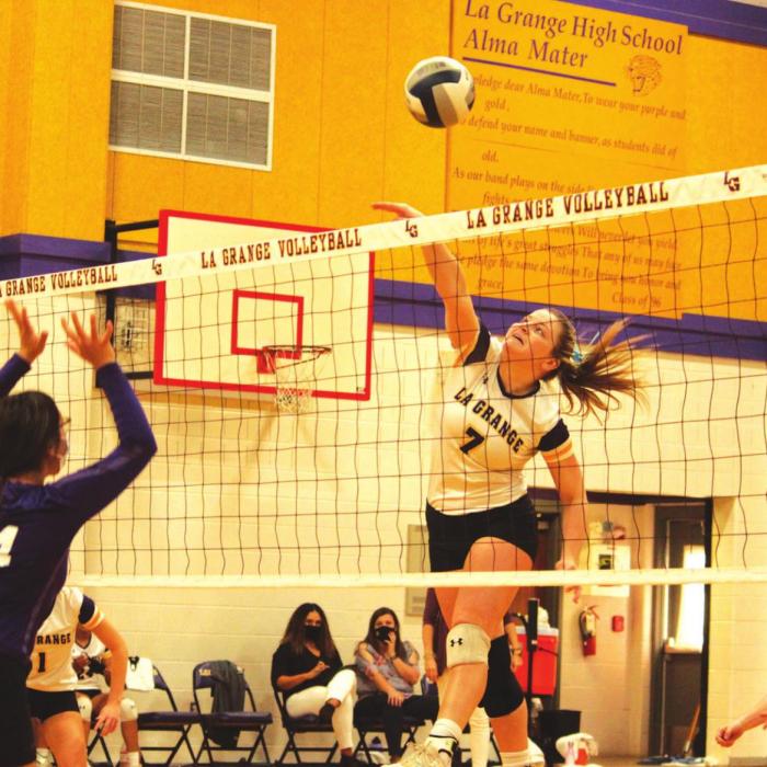 La Grange’s Natalie Blackwell spikes the ball in action Tuesday against Austin Achieve. Photos by Jeff Wick