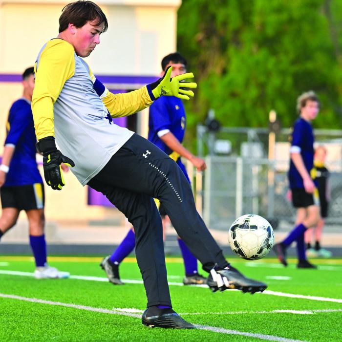 La Grange goalie Will Bundick boots the ball during action Tuesday night against Rockdale. Photo by Stephanie Steinhauser