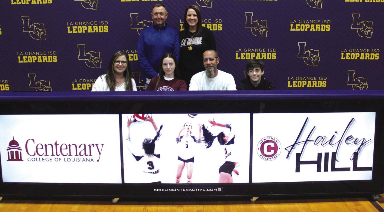 La Grange volleyball star Hailey Hill signed her scholarship agreement Tuesday to play college volleyball for Centenary College of Louisiana. Front row, left to right, are Catherine Hill (Hailey’s mother), Hailey Hill, Travis Hill (Hailey’s Father) and Travis Hill (Hailey’s brother). Standing, left to right are Milton Koller (Hailey’s club volleyball coach), and Leslie Coltrain, La Grange High School volleyball coach. Photo by Jeff Wick
