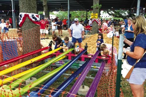St. John Picnic offered lots of games for the kids, including this duck race. Photos by Andy Behlen
