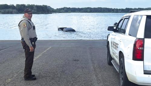 Man Swims to Safety After Truck Rolls into Lake
