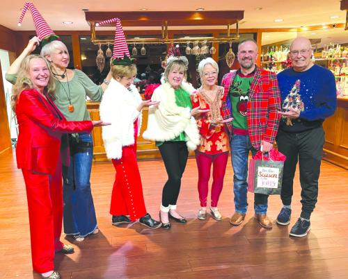 During the La Grange Noon Lions Club annual Christmas party the most festive outfit was awarded to Lion Gregory Kallus. Pictured from left to right are Melissa Weltner, Lada Kubrak, Ruby McGill, Diana Wilson, Adrienne Armstrong, Gregory Kallus, and Bill Bailey.