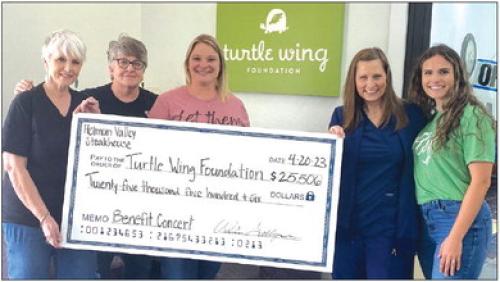 Pictured from left: Patti Van Dyck, Wendy Galleymore (Holman Valley Owner), Heather Pavlu, Dee-Ann Hooper (Turtle Wing Founder and Board President), and Destiny Psencik (Turtle Wing Executive Director).
