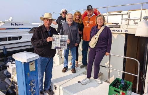 Charlie and Seri Davis of La Grange, Frank and Linda Jones of La Grange and Scott and Jan Hughes of Round Top captained a houseboat in Holland cruising the canals around Amsterdam for seven days. It rained every day with 20 MPH winds and cold temps but as soon as the sun came out they took a picture with their favorite newspaper.