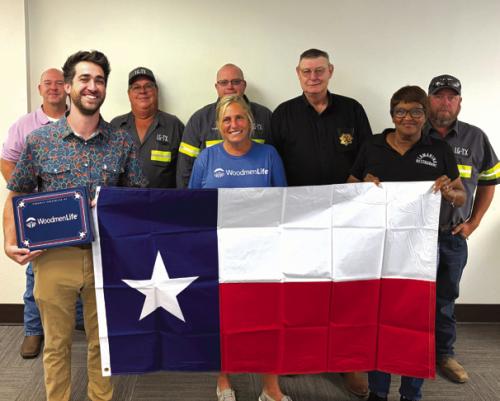 Pictured from left: Brett Wolf, Caleb Parks, Don Jakobeit, Andy Blaha, Cami Dixon, Officer David Gilbreath, Jan Dockery, and Clint Nichols.