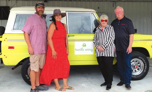 Pictured from left are: Andy Slater and Julie Shumney, winners, with Betty and John Burkland, donors.