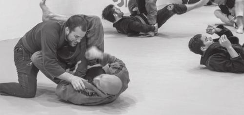 A snapshot of the action being showcased during the Brazilian Jiu Jitsu studio’s grand opening in La Grange three weeks ago. Photo by Andy Behlen