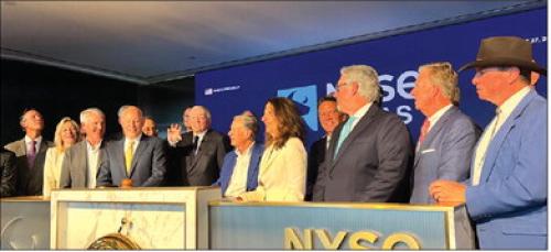 Wayne Penello, founder and CEO of Columbus-based NextGen EMP, far right in cowboy hat, joins New York Stock Exchange President Lynn Martin, Texas Governor Greg Abbott and other business and government leaders on the podium for the August 27 grand opening of NYSE Texas in Dallas. Abbott rang the NYSE Closing Bell to mark the occasion.