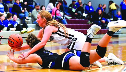 Flatonia’s Laurel Betak fights for possession of the ball in Tuesday night’s game against Yoakum. Flatonia lost 36-34. Photo by Stephanie Steinhauser
