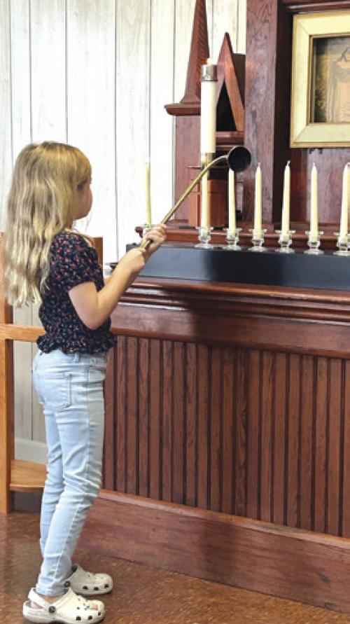 Lily Kindsvatter lit the candles in remembrance of those that passed in the last year from Shared Lutheran Ministry. St. John in Ellinger hosted the service and brunch afterwards on Sunday, Nov. 3.