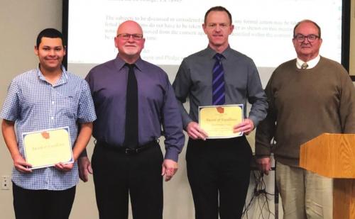 La Grange High School student Jose Estrada, left, was honored at Monday night’s meeting for his earning a place in the 2022 ATSSB All-State Band. Next to him, left to right are school board President Gary Drab, Band Director Christopher Cooper, and Superintendent Bill Wagner. Photo by Regina Keilers