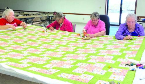 Ladies of St. John and St. Mary quilting for St. John Altar Society pictured from left: Joann Tobias, Lenora Zapalac, Rosemary Ermis and Gladys Polasek.